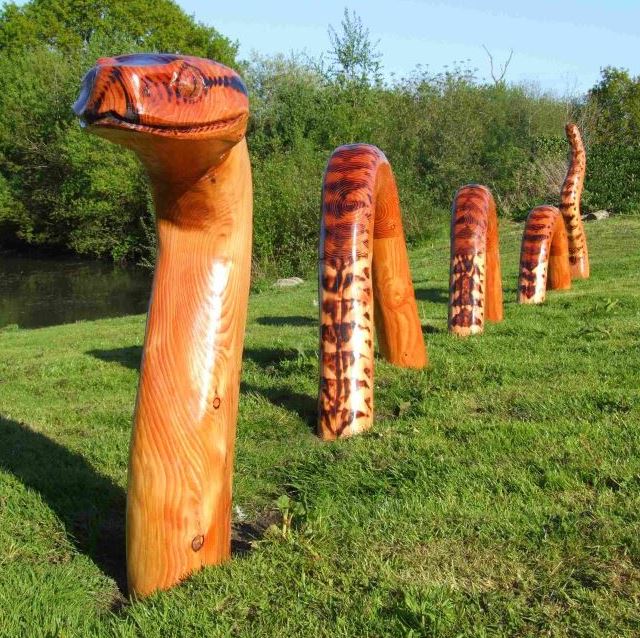 large wooden sculpture of an adder